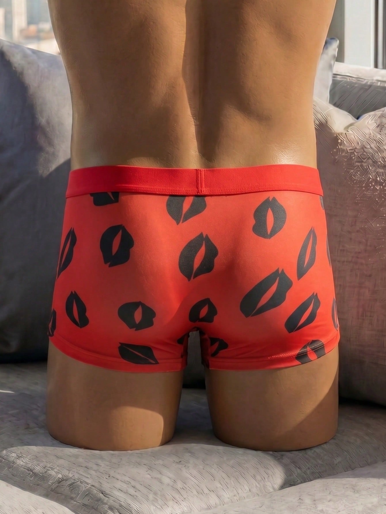 Red sheer men's mesh boxer shorts with tape detail, mid-rise waist, and slight stretch knitted fabric.