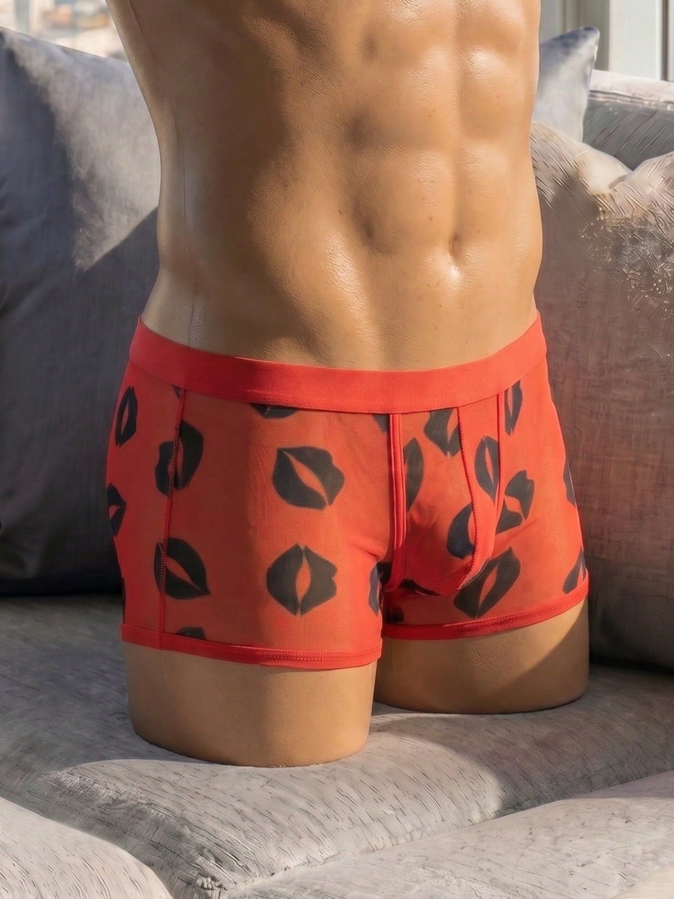 Red sheer men's mesh boxer shorts with tape detail, mid-rise waist, and slight stretch knitted fabric.