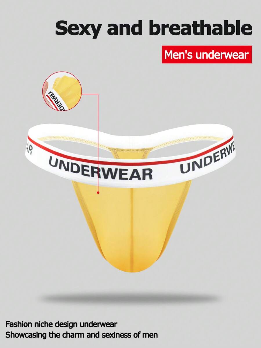 Low rise men's thong underwear with rhinestone letter print detail.
