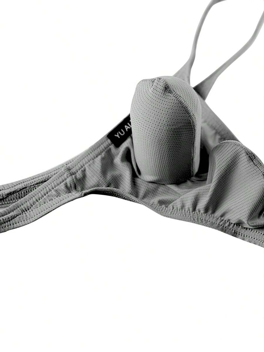 3-pack of men's low-rise g-string thong underwear featuring a bulge pouch design, breathable mesh fabric, and high elastic waistband.