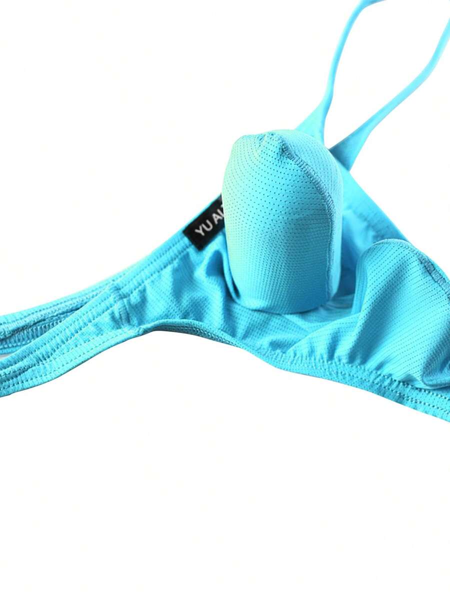 3-pack of men's low-rise g-string thong underwear featuring a bulge pouch design, breathable mesh fabric, and high elastic waistband.