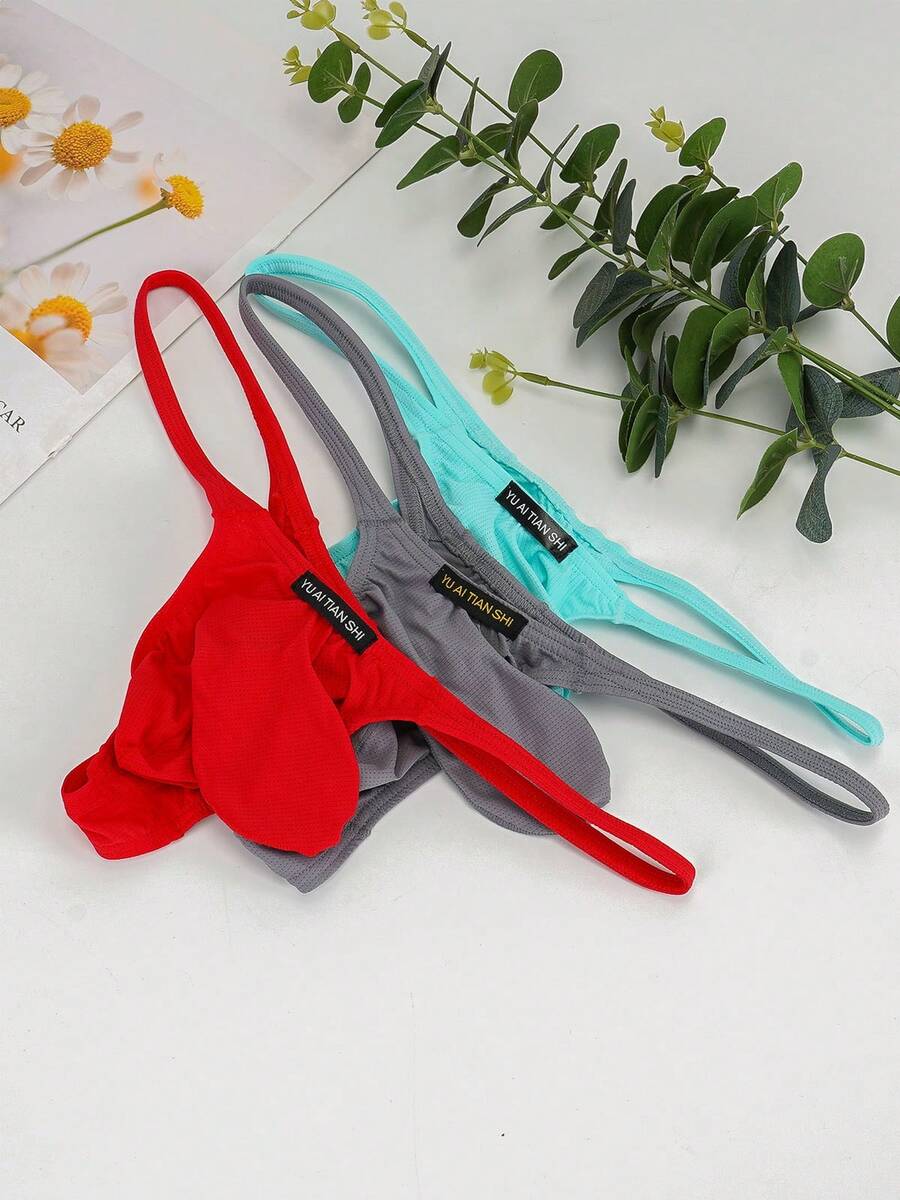 3-pack of men's low-rise g-string thong underwear featuring a bulge pouch design, breathable mesh fabric, and high elastic waistband.