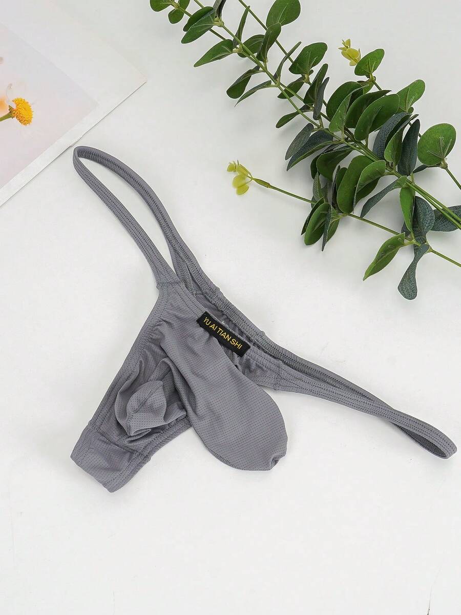 3-pack of men's low-rise g-string thong underwear featuring a bulge pouch design, breathable mesh fabric, and high elastic waistband.