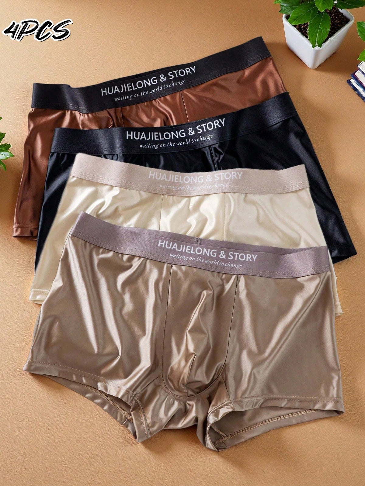 A 4-piece set of men's multicolor silk-like mid rise trunks crafted from soft knitted fabric with slight stretch and inner lining.