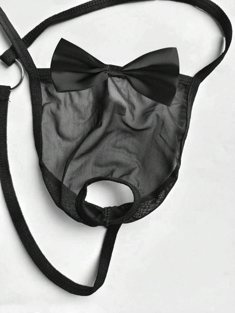 Black 2-piece men's semi-sheer thong set featuring bow and ring decor with a matching neck collar.