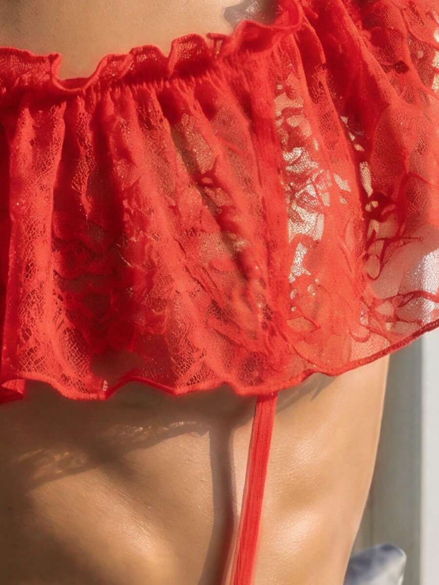 Red men's lingerie vest featuring a floral lace pattern, round neck, backless design, and ruffle hem.