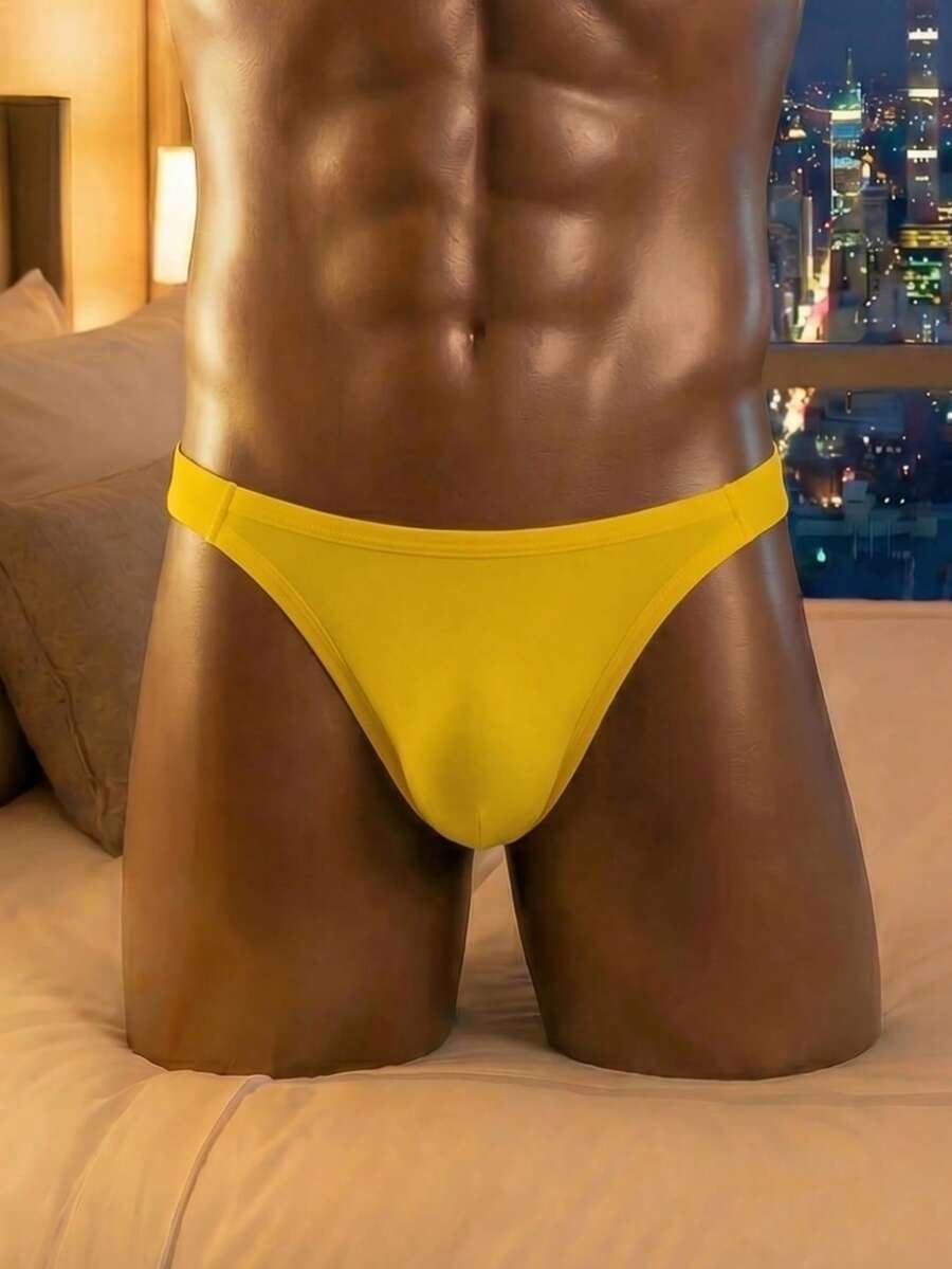 Men's low rise hollow jockstrap underwear crafted from solid black medium stretch knitted fabric.