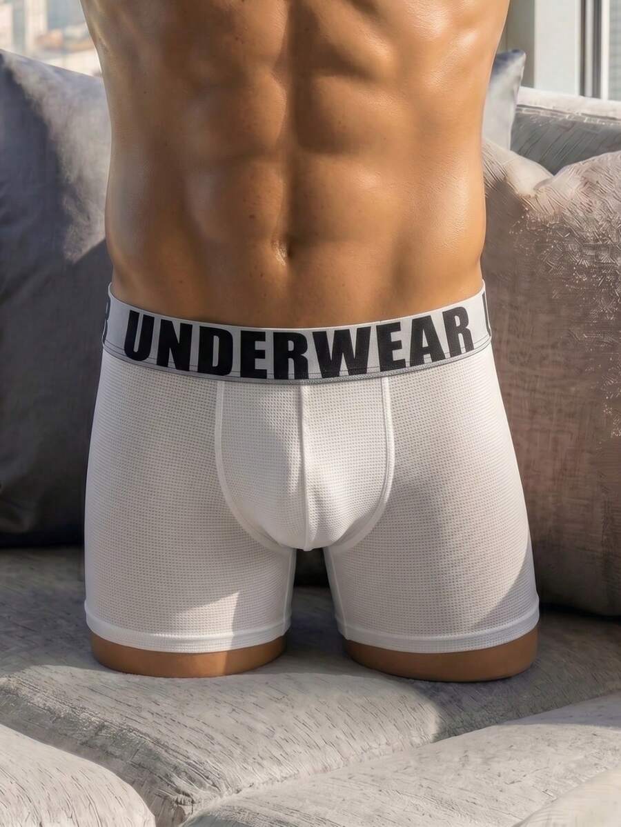 Front view of men's plain white low rise square cut boxer shorts made of stretch knitted fabric.
