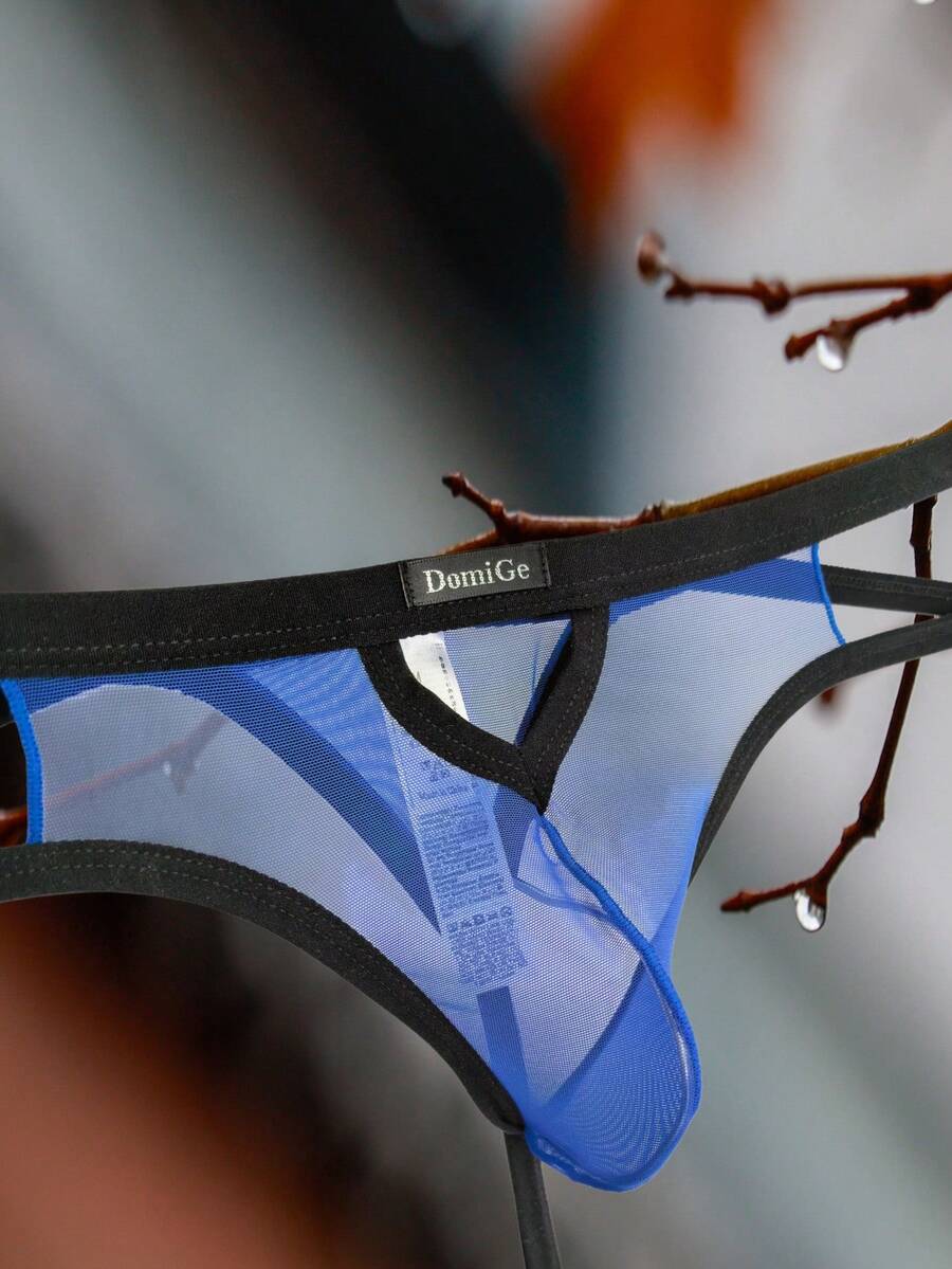 Men's black mesh G-string thong underwear featuring a low-waist cut-out front design.