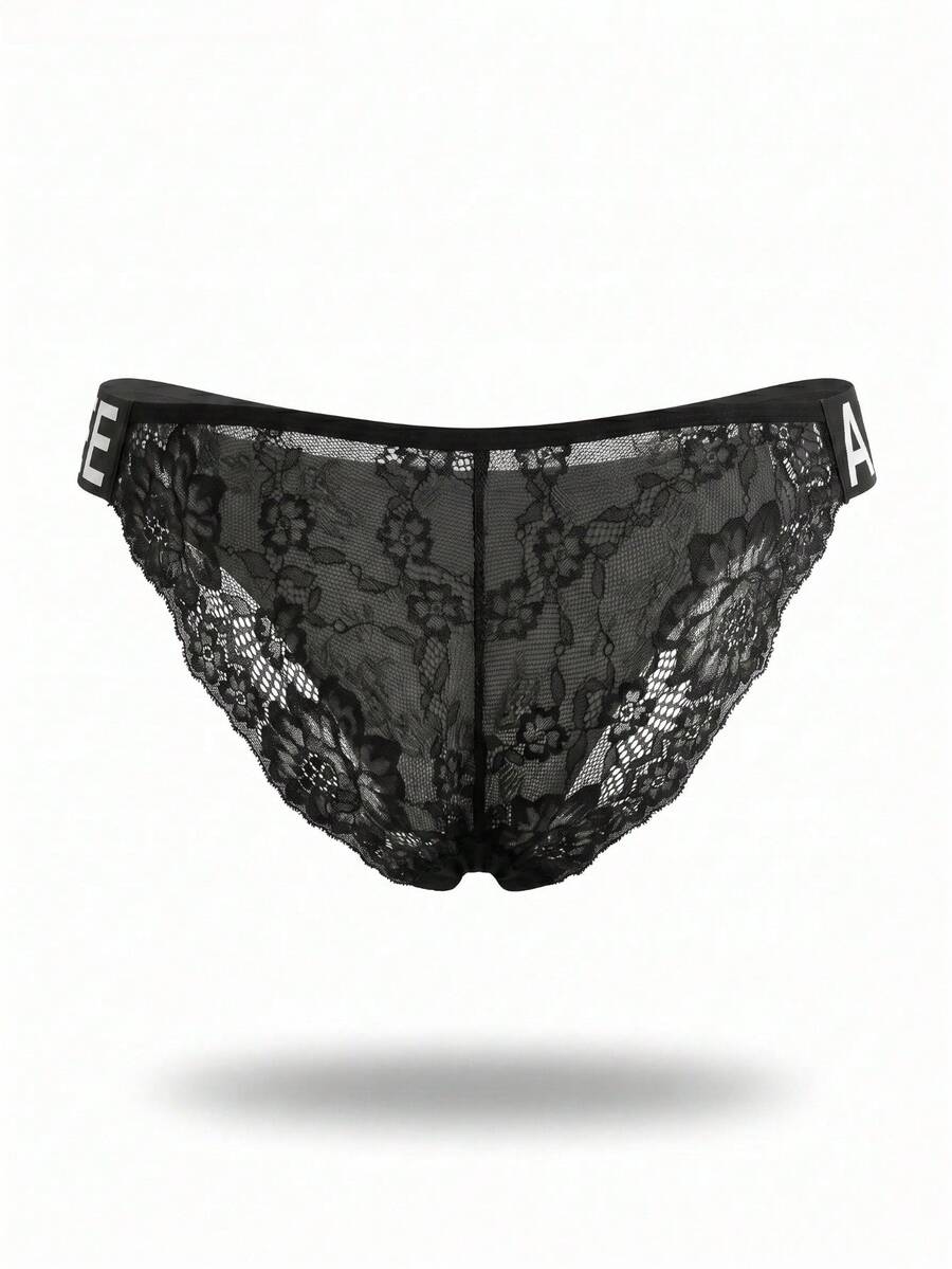 Black men's triangle briefs featuring double-sided webbing lace tape detail in semi-sheer knitted fabric.