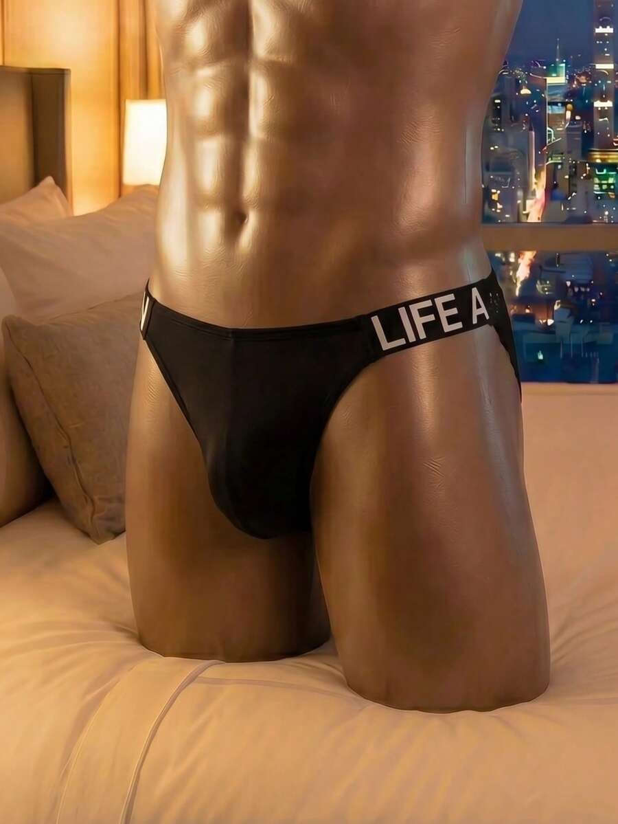 Black men's triangle briefs featuring double-sided webbing lace tape detail in semi-sheer knitted fabric.