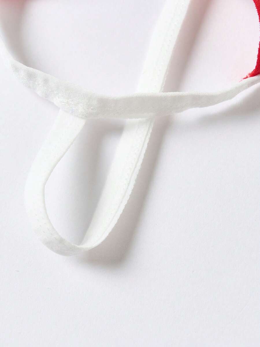 Men's low rise colorblock thong underwear in red and white knitted fabric.