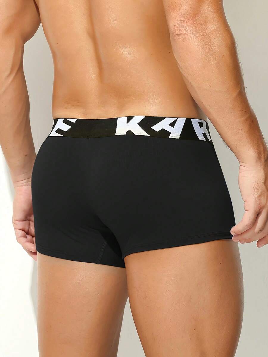 Men's sporty underwear trunks in royal blue featuring an opening pouch design, mid-rise elastic waistband, and colorblock patched details.