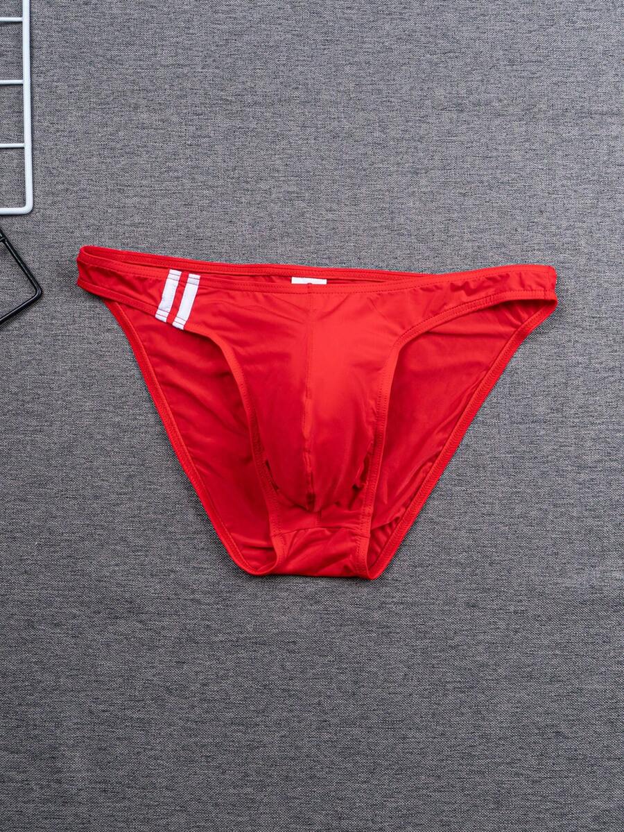 Multicolor men's low-rise briefs with contrast piping made from soft stretch knitted fabric.