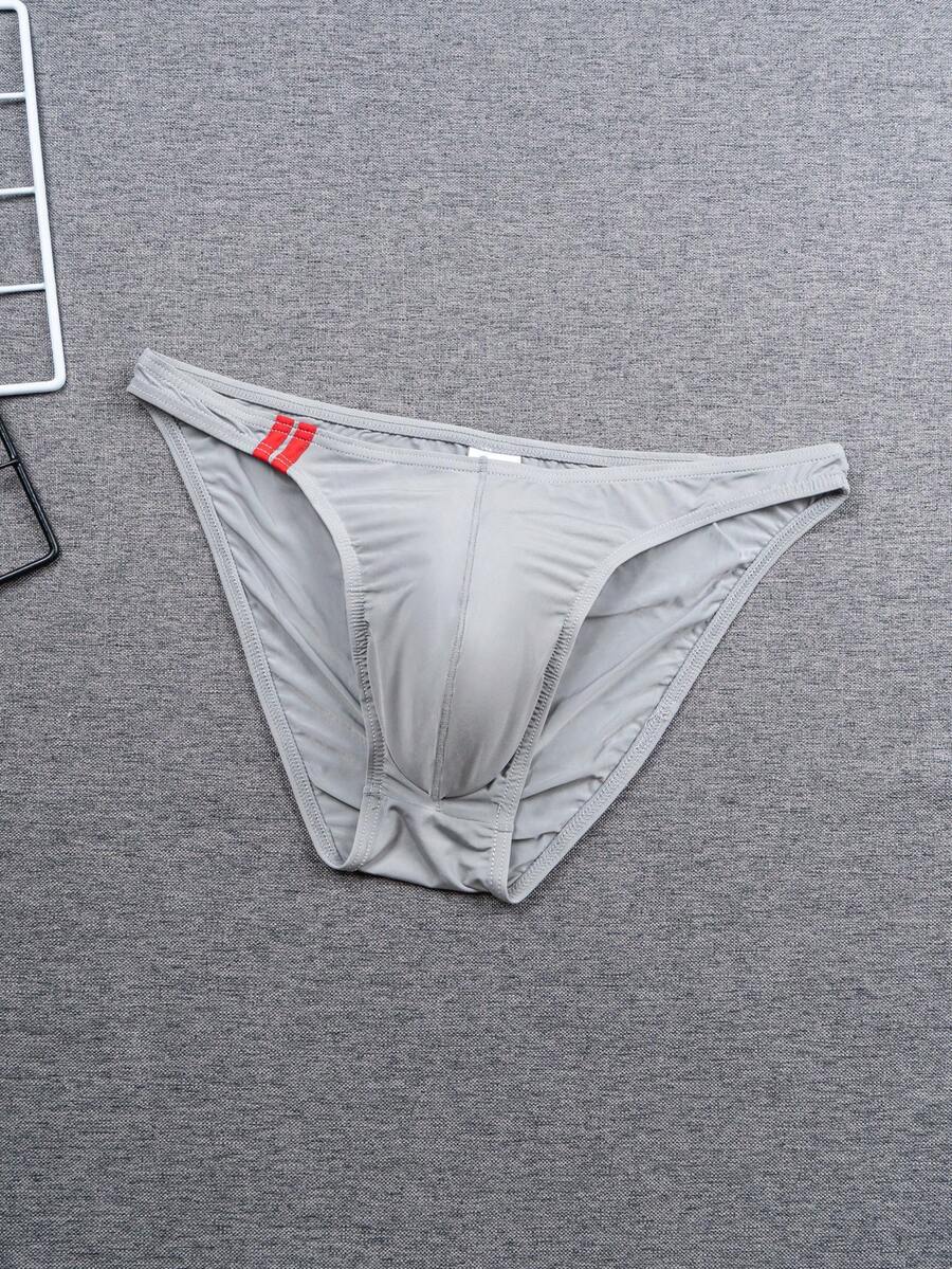 Multicolor men's low-rise briefs with contrast piping made from soft stretch knitted fabric.