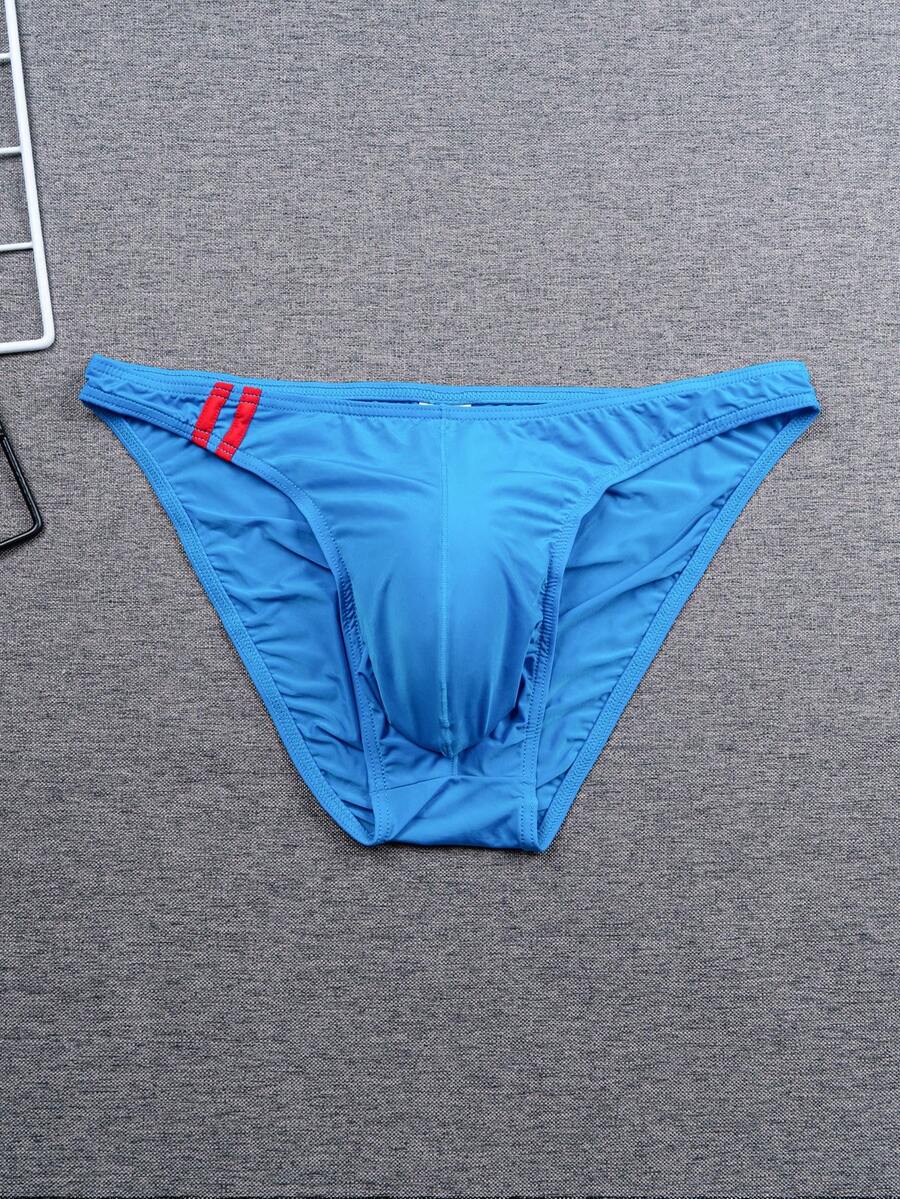 Multicolor men's low-rise briefs with contrast piping made from soft stretch knitted fabric.