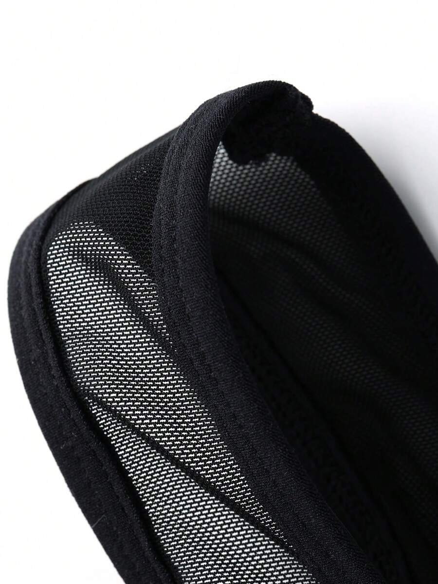 Black scoop neck sheer romper boxer shorts for men featuring low rise fit and knitted fabric.