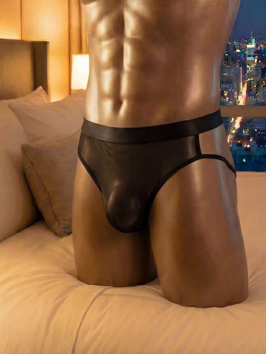 Black men's low rise triangle briefs featuring contrast mesh panels and cut-out details made of knitted fabric.