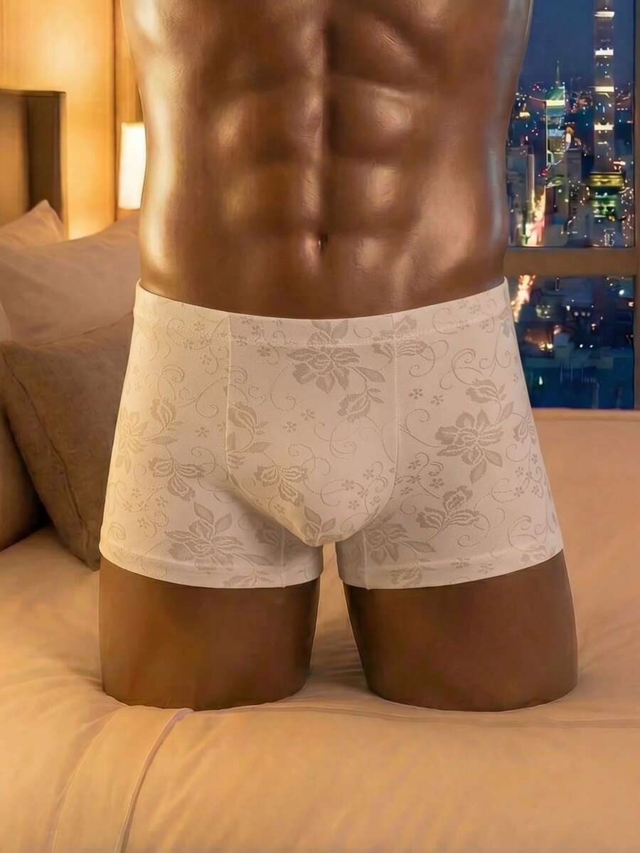 White low rise men's mesh boxer shorts featuring a plant print and rib-knit details.