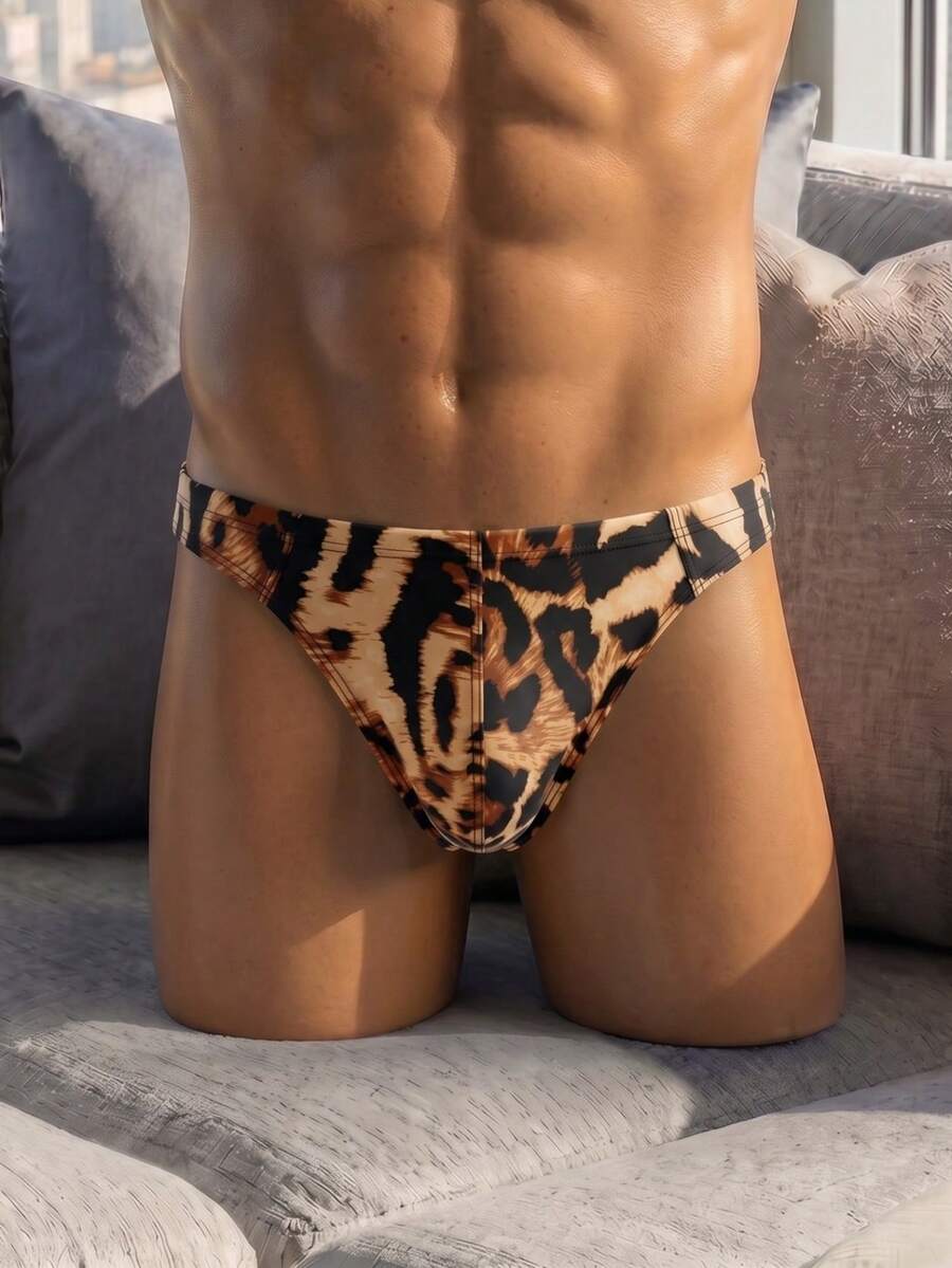 Men's leopard print thong underwear featuring a low-rise fit and high-stretch multicolor fabric.