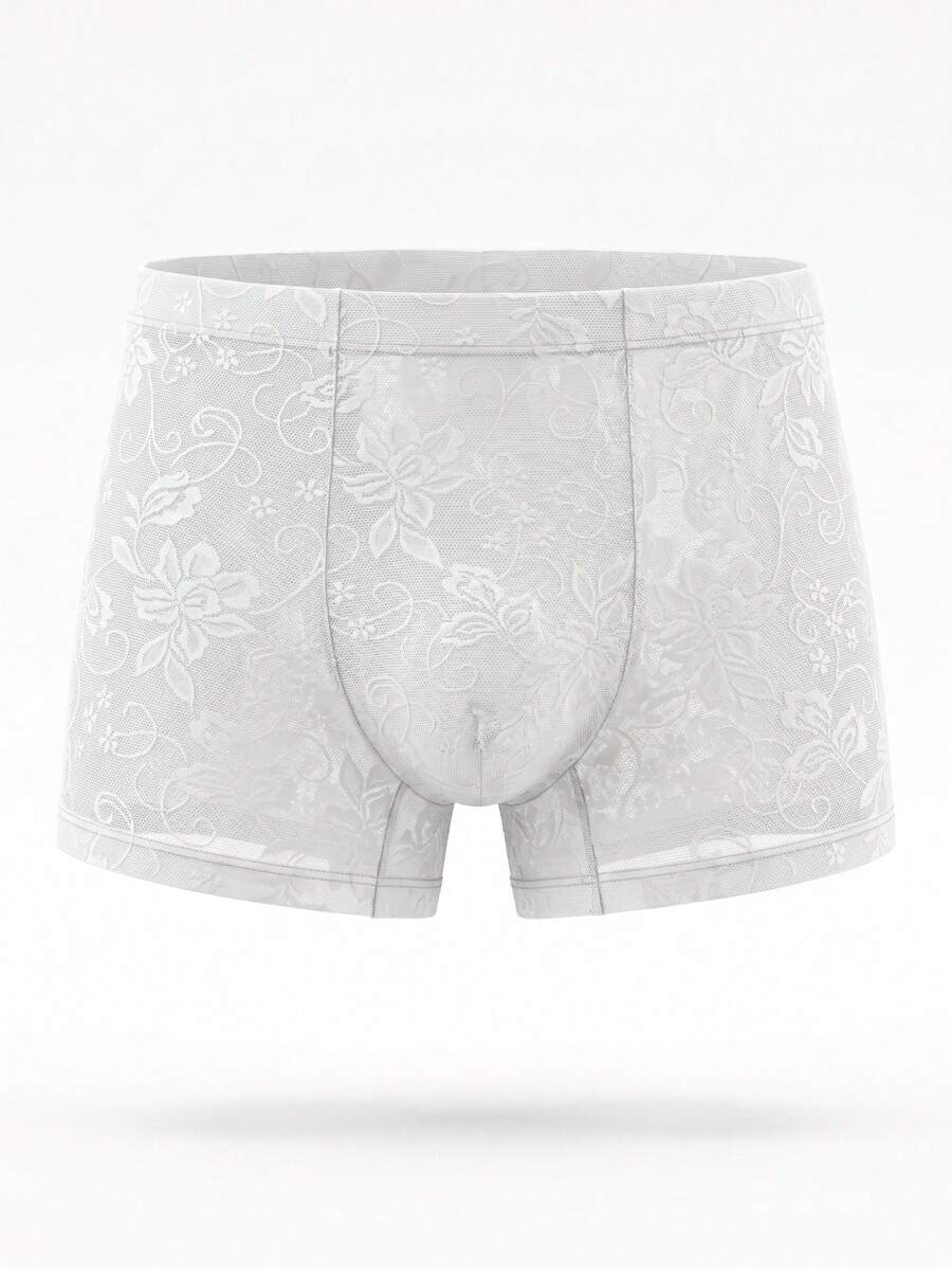 White low rise men's mesh boxer shorts featuring a plant print and rib-knit details.