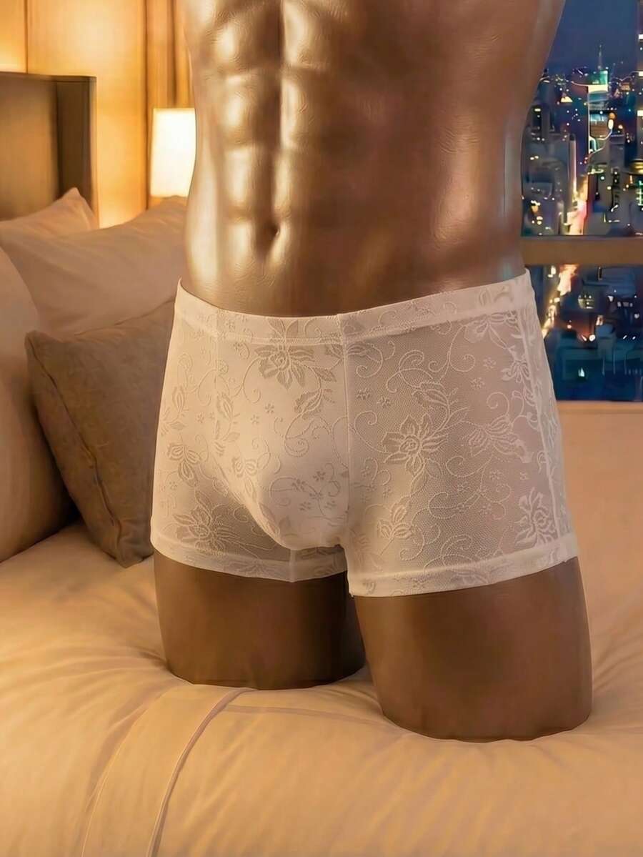 White low rise men's mesh boxer shorts featuring a plant print and rib-knit details.