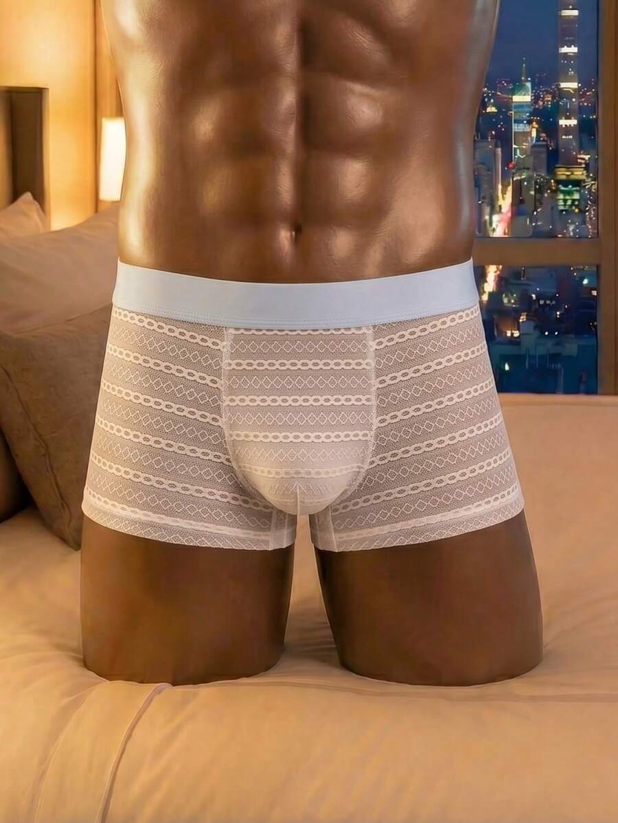 White men's mesh boxer shorts featuring cut out details, mid-rise waist, and a striped pattern design.