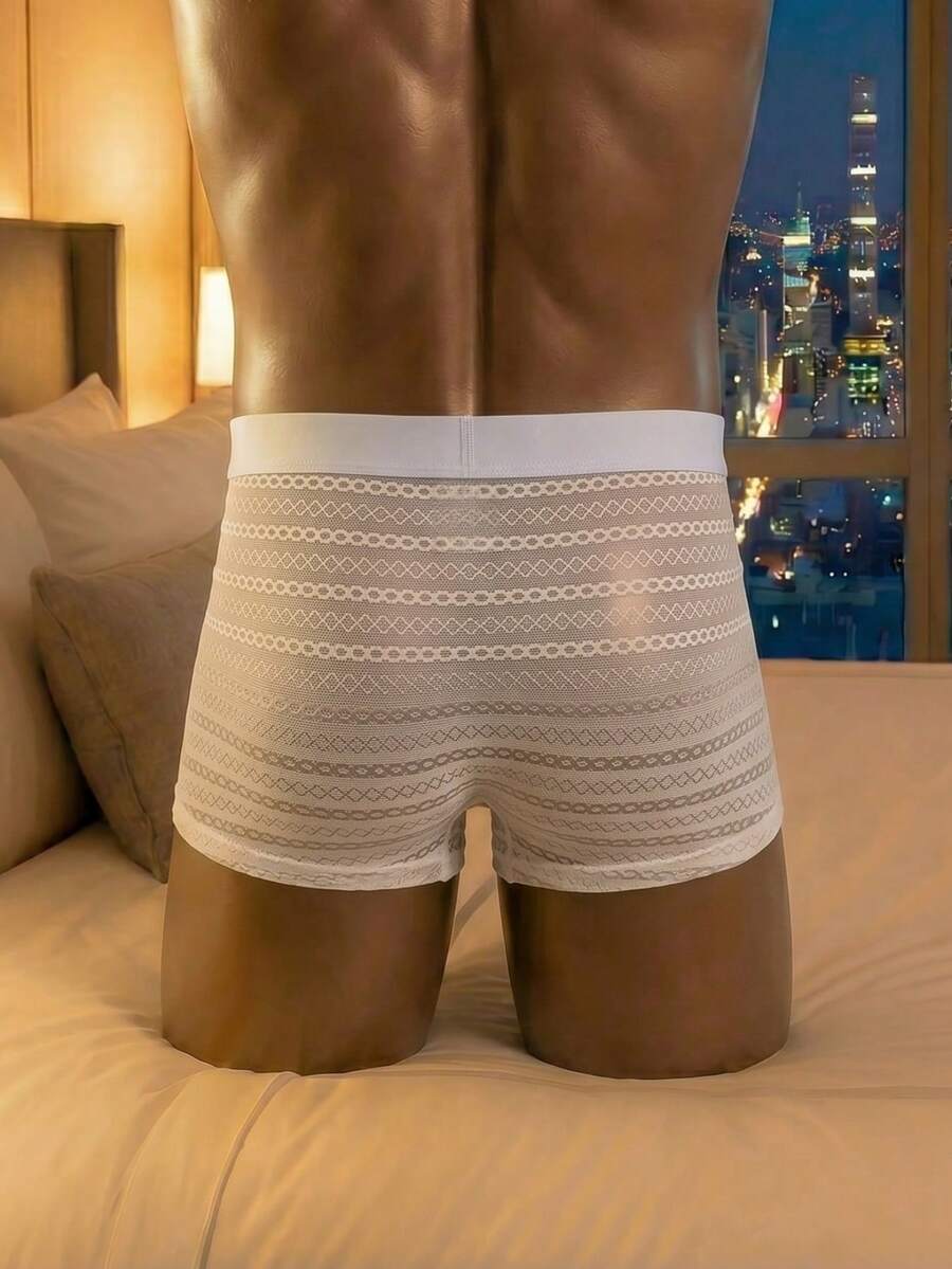 White men's mesh boxer shorts featuring cut out details, mid-rise waist, and a striped pattern design.