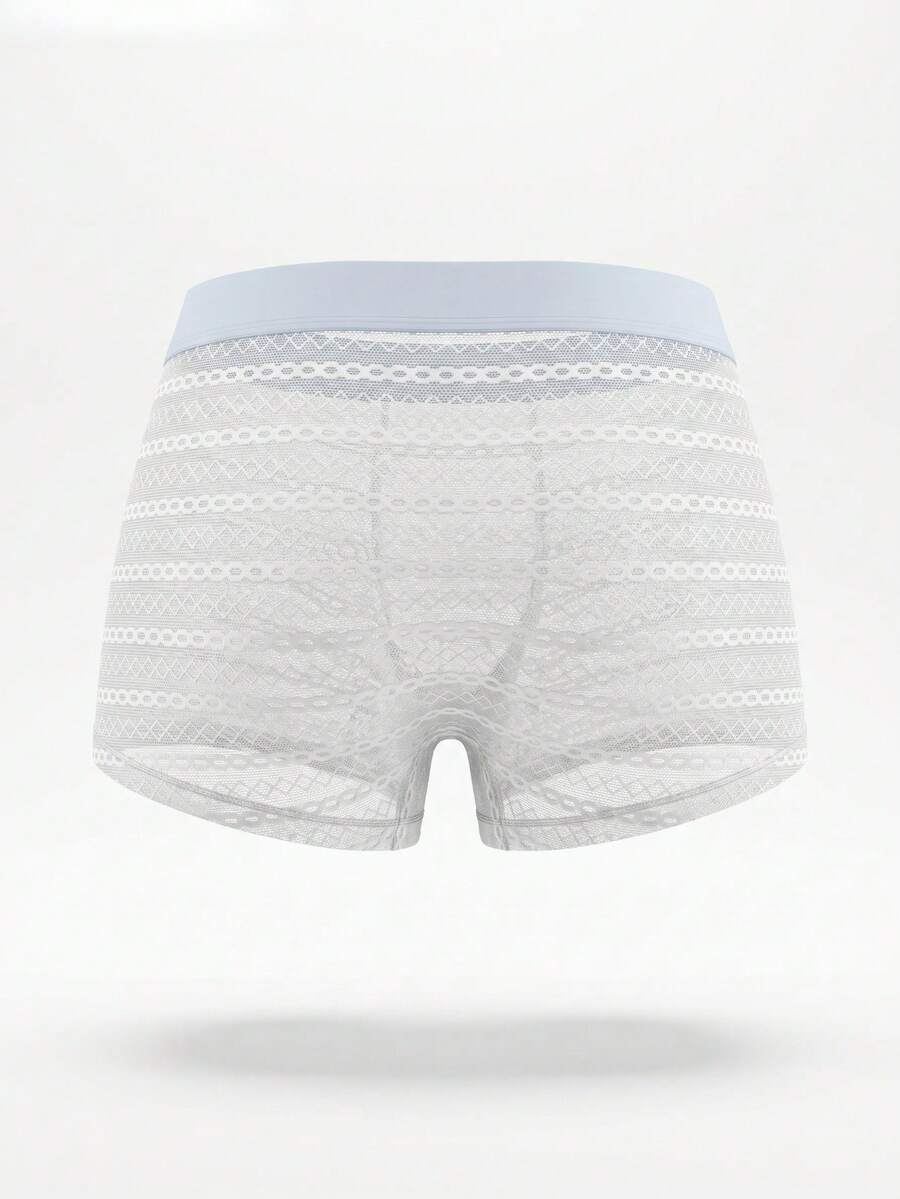 White men's mesh boxer shorts featuring cut out details, mid-rise waist, and a striped pattern design.