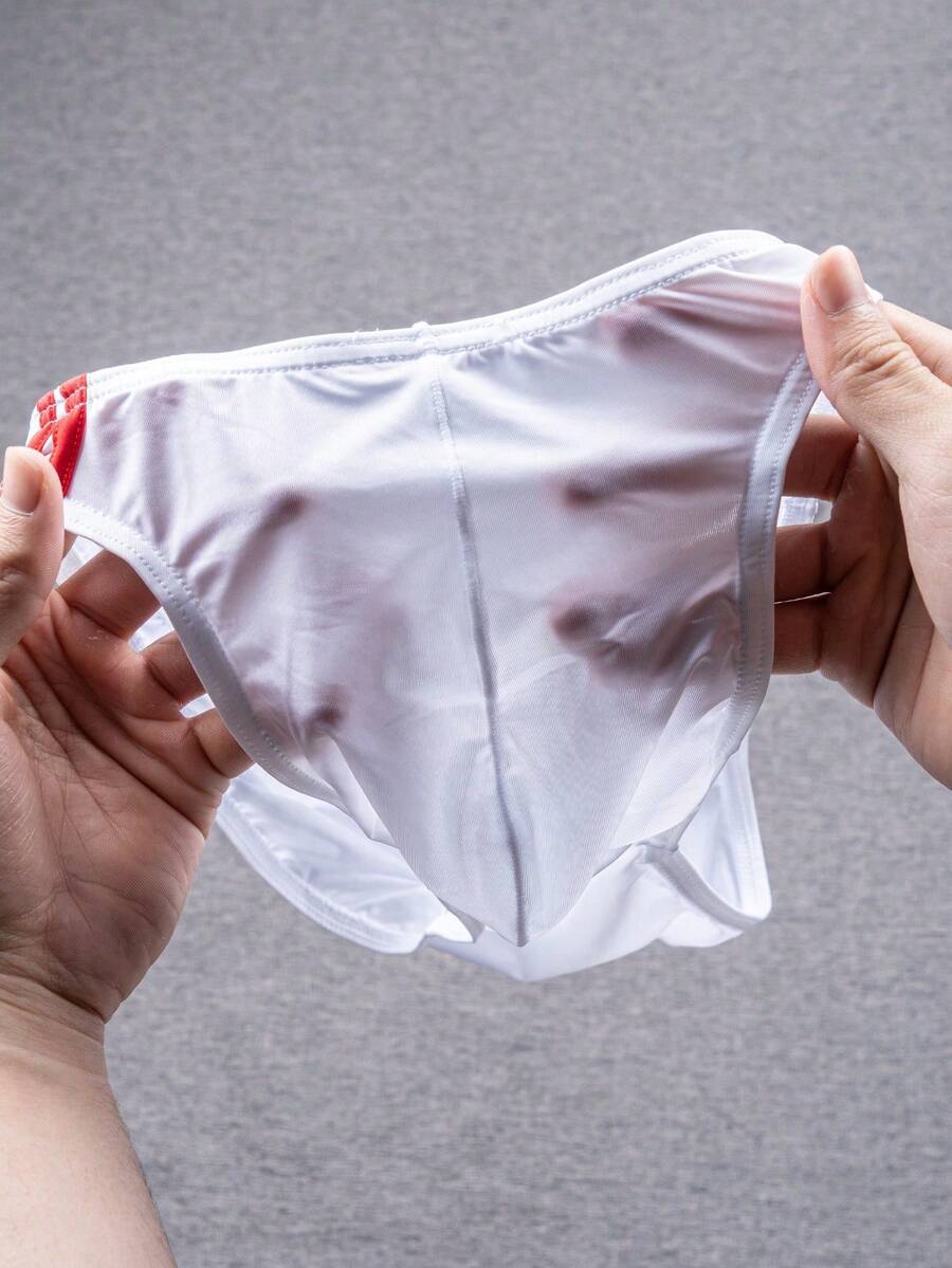 Multicolor men's low-rise briefs with contrast piping made from soft stretch knitted fabric.