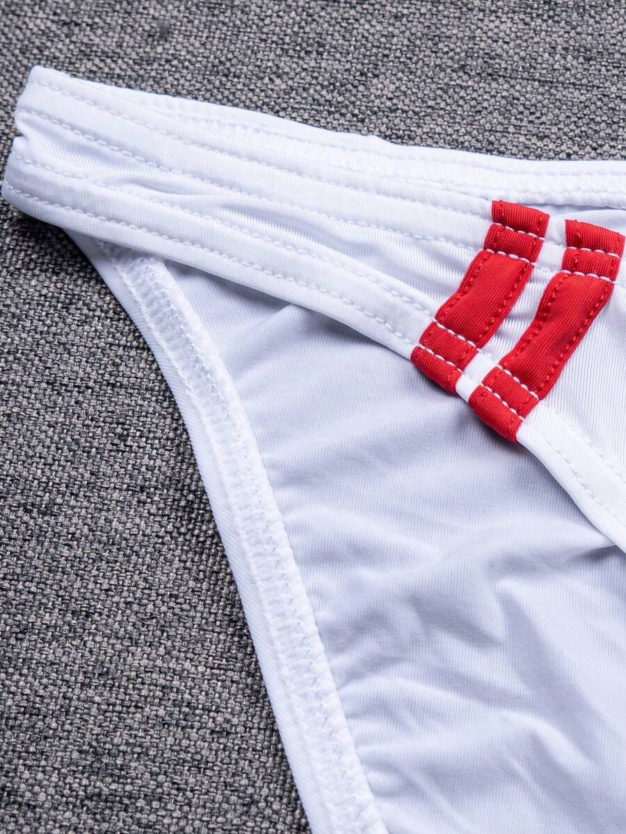 Multicolor men's low-rise briefs with contrast piping made from soft stretch knitted fabric.