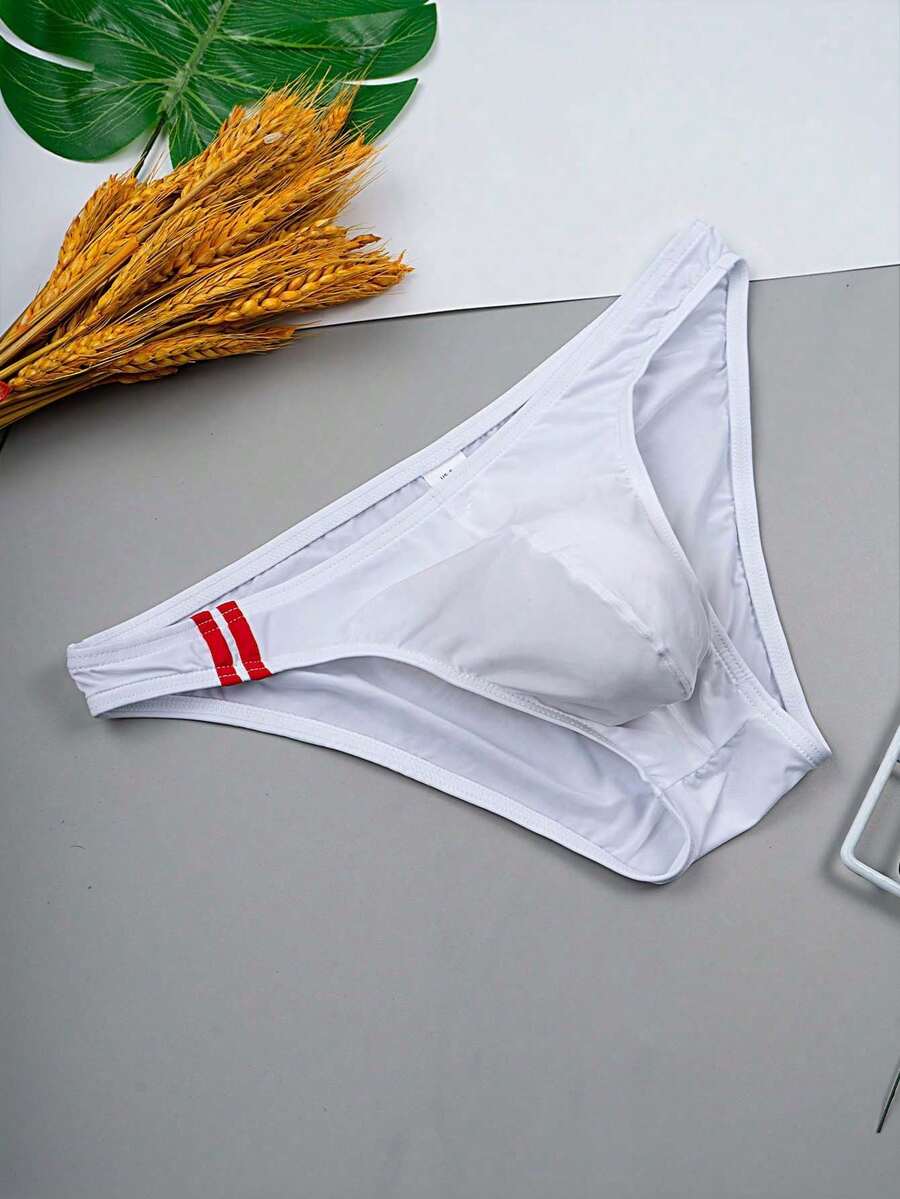 Multicolor men's low-rise briefs with contrast piping made from soft stretch knitted fabric.