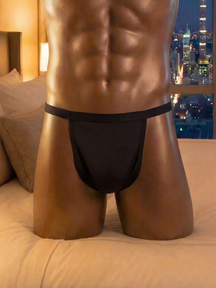 Black low rise men's thong underwear made of stretch knitted fabric