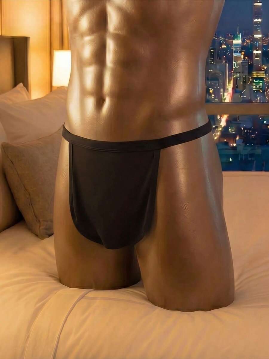 Black low rise men's thong underwear made of stretch knitted fabric