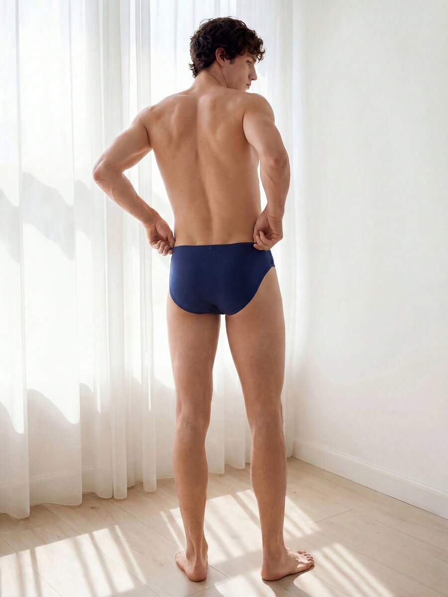 Navy blue men's mid rise sporty brief with cut out detail made from soft knitted stretch fabric.