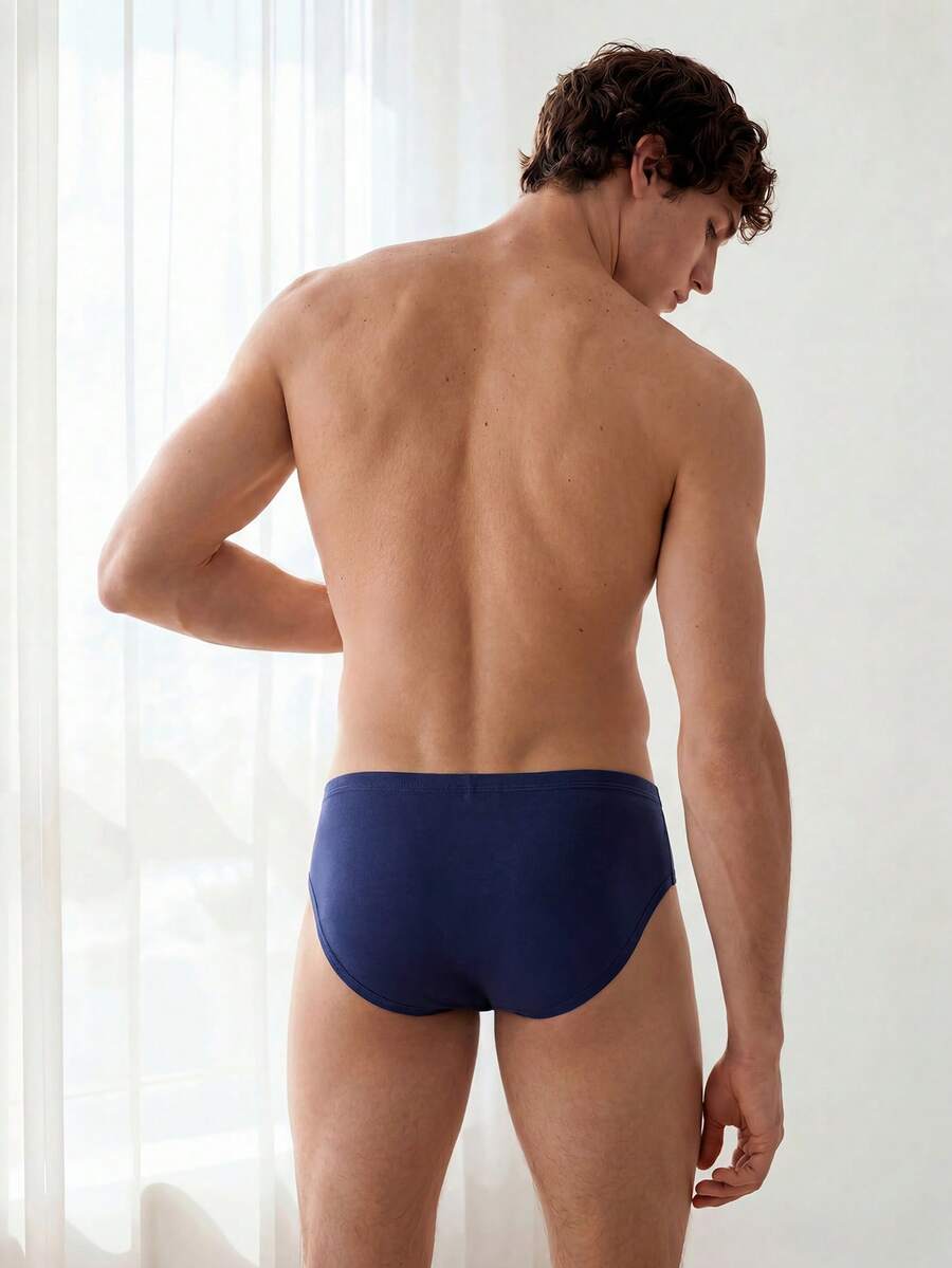 Navy blue men's mid rise sporty brief with cut out detail made from soft knitted stretch fabric.
