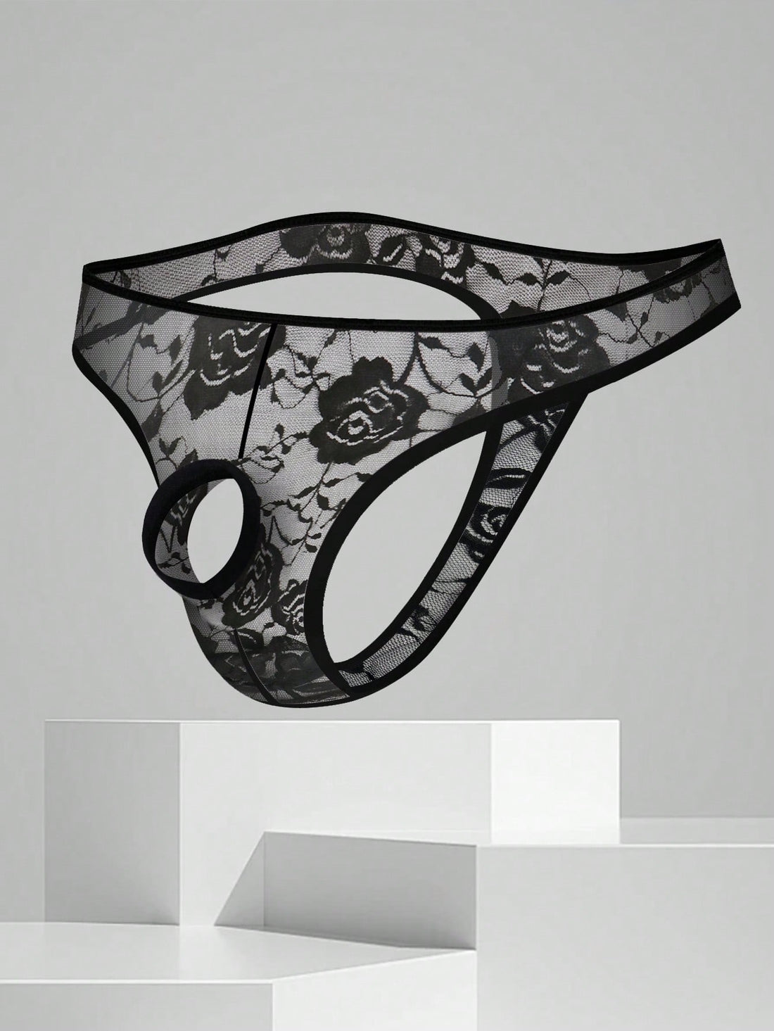 Men's black semi-sheer floral lace thong underwear featuring cut out design and low rise waistband.