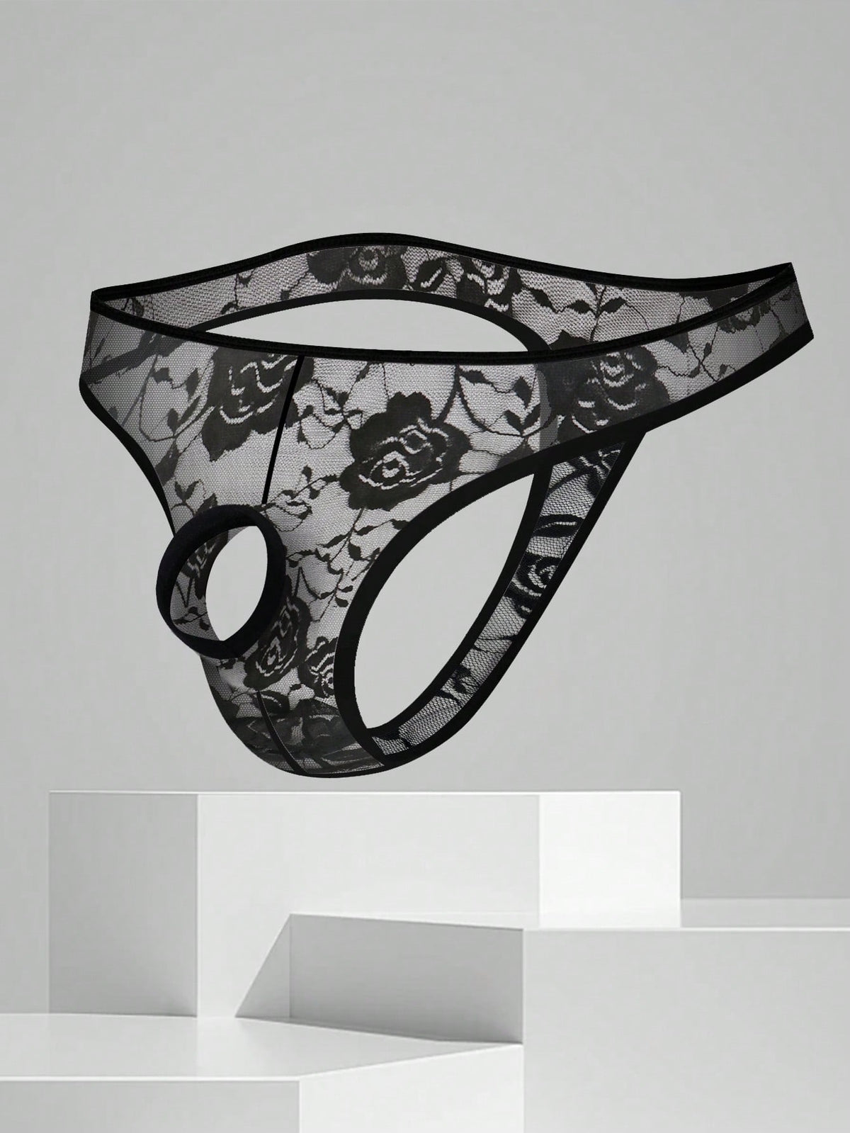 Men's black semi-sheer floral lace thong underwear featuring cut out design and low rise waistband.