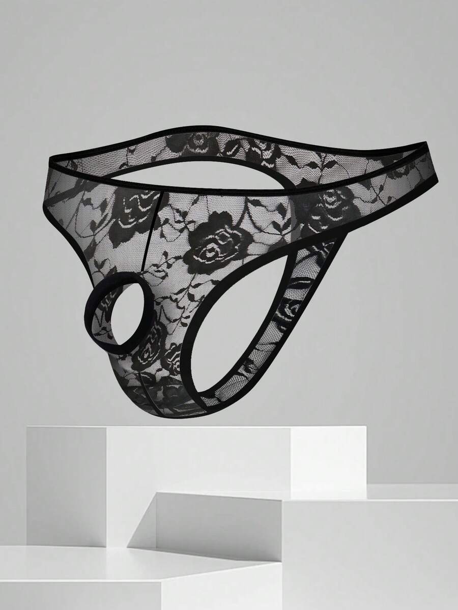 Men's black semi-sheer floral lace thong underwear featuring cut out design and low rise waistband.