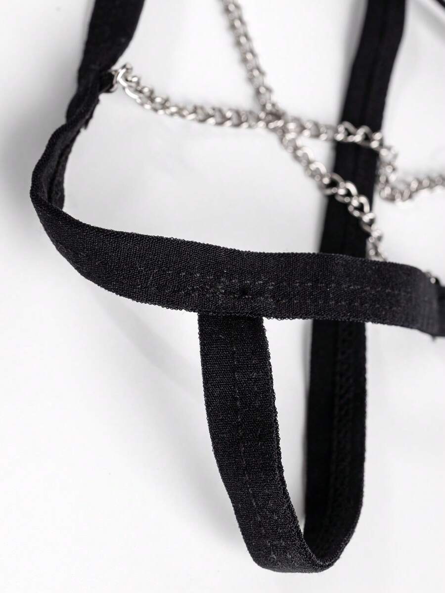 Black men's low rise thong underwear with chain detail and colorblock knitted fabric design