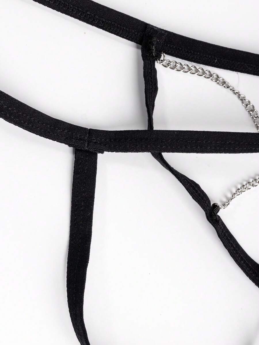 Black men's low rise thong underwear with chain detail and colorblock knitted fabric design