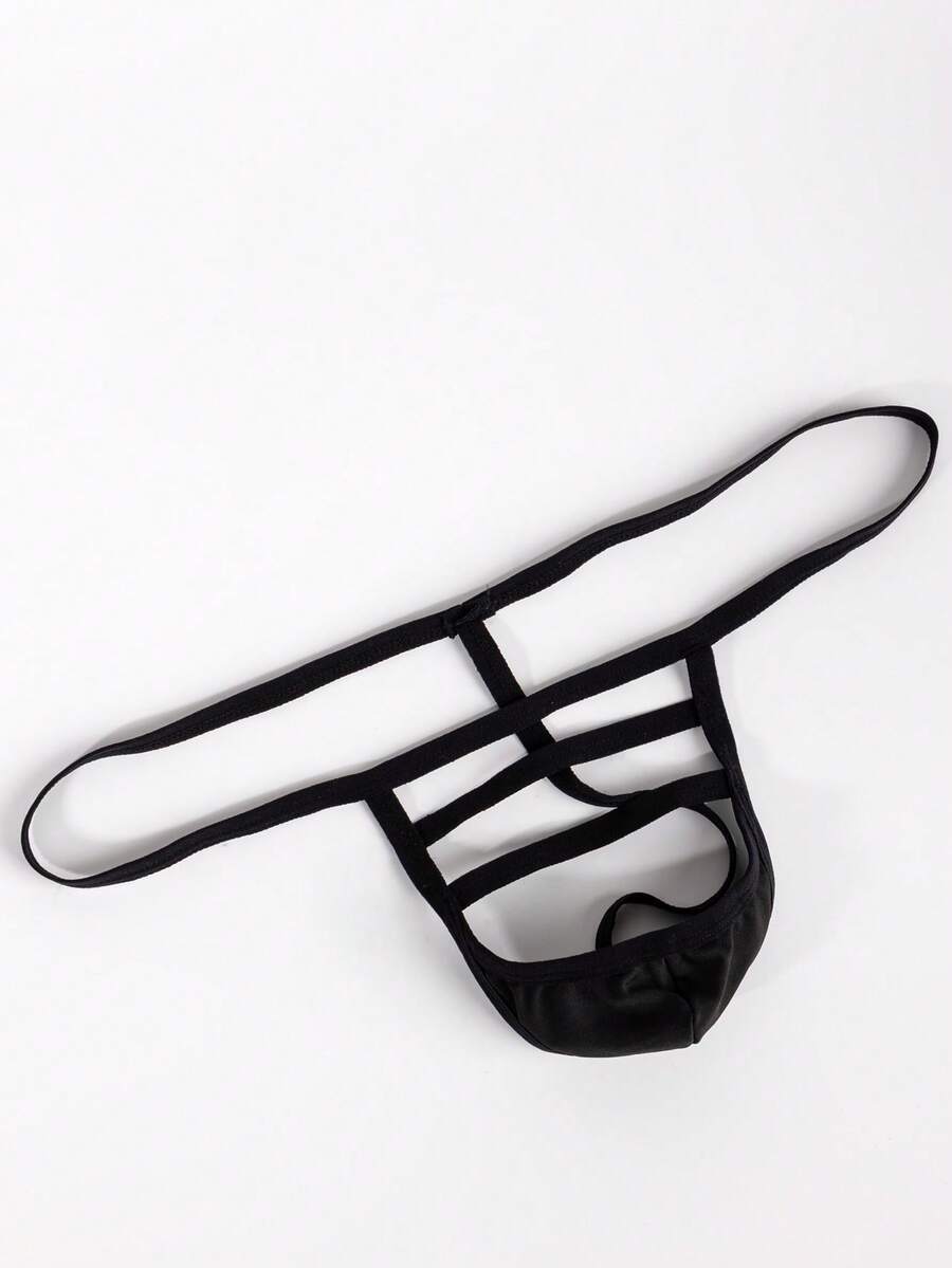Black low-rise men's T-back thong underwear featuring an anti-slip design made from knitted medium-stretch fabric.