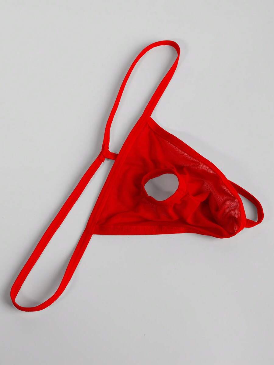Men's red mesh thong underwear featuring a low-rise waist and hollow-out design.