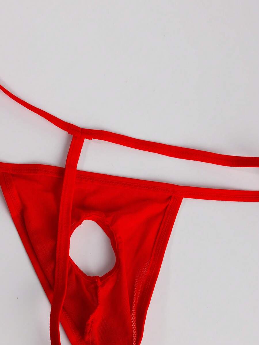 Men's red mesh thong underwear featuring a low-rise waist and hollow-out design.