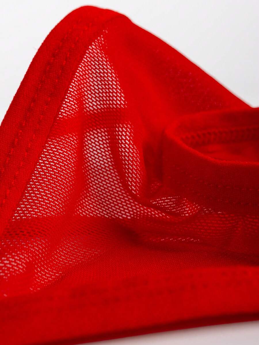 Men's red mesh thong underwear featuring a low-rise waist and hollow-out design.