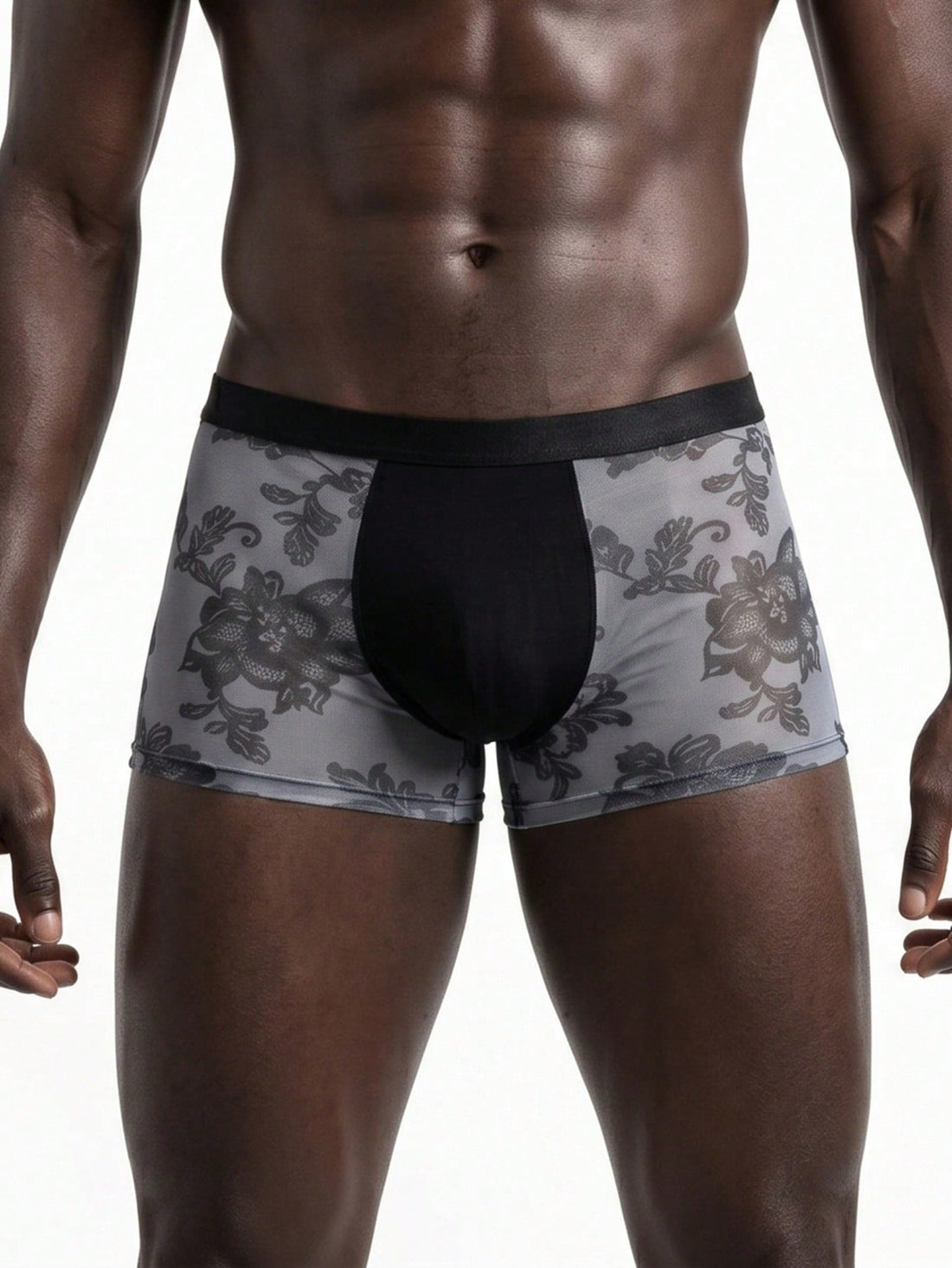 Men's grey low-rise semi-sheer mesh boxer briefs with plant pattern and contrast binding.
