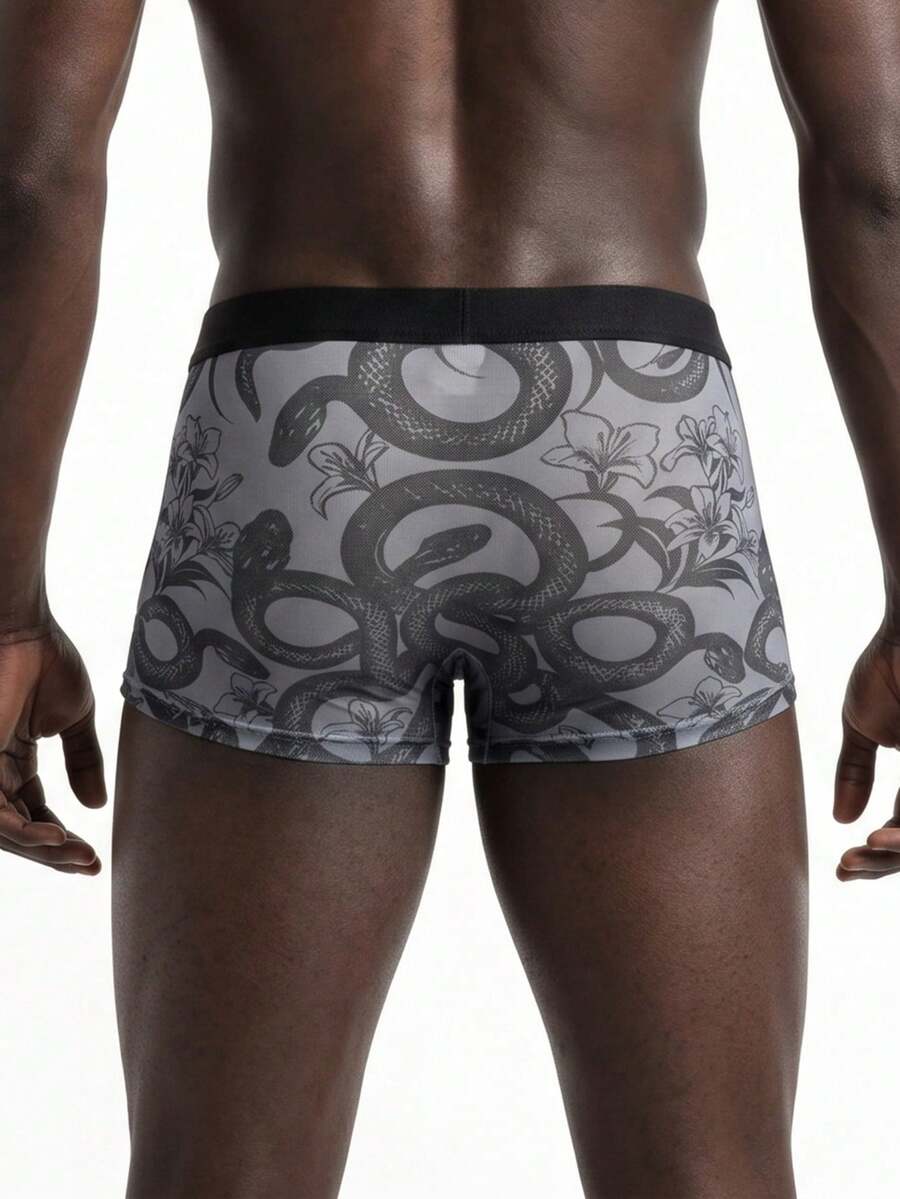 Men's grey low-rise semi-sheer mesh boxer briefs with plant pattern and contrast binding.