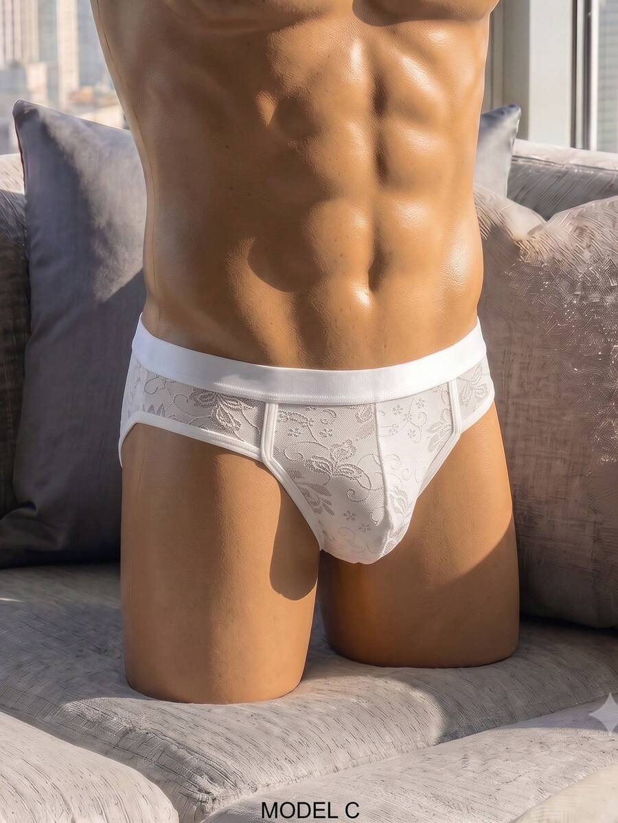 White low-rise men's lace thong underwear featuring a plant pattern.
