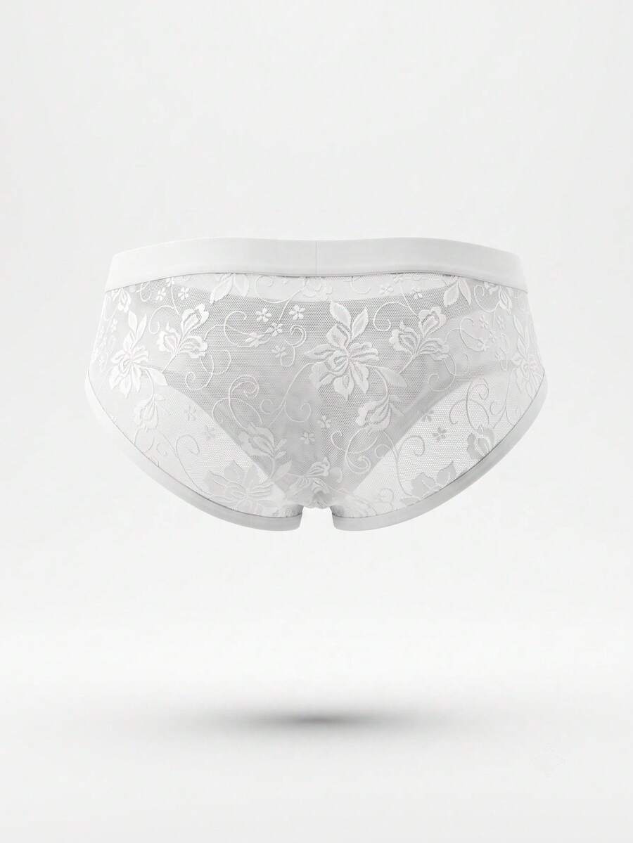 White low-rise men's lace thong underwear featuring a plant pattern.
