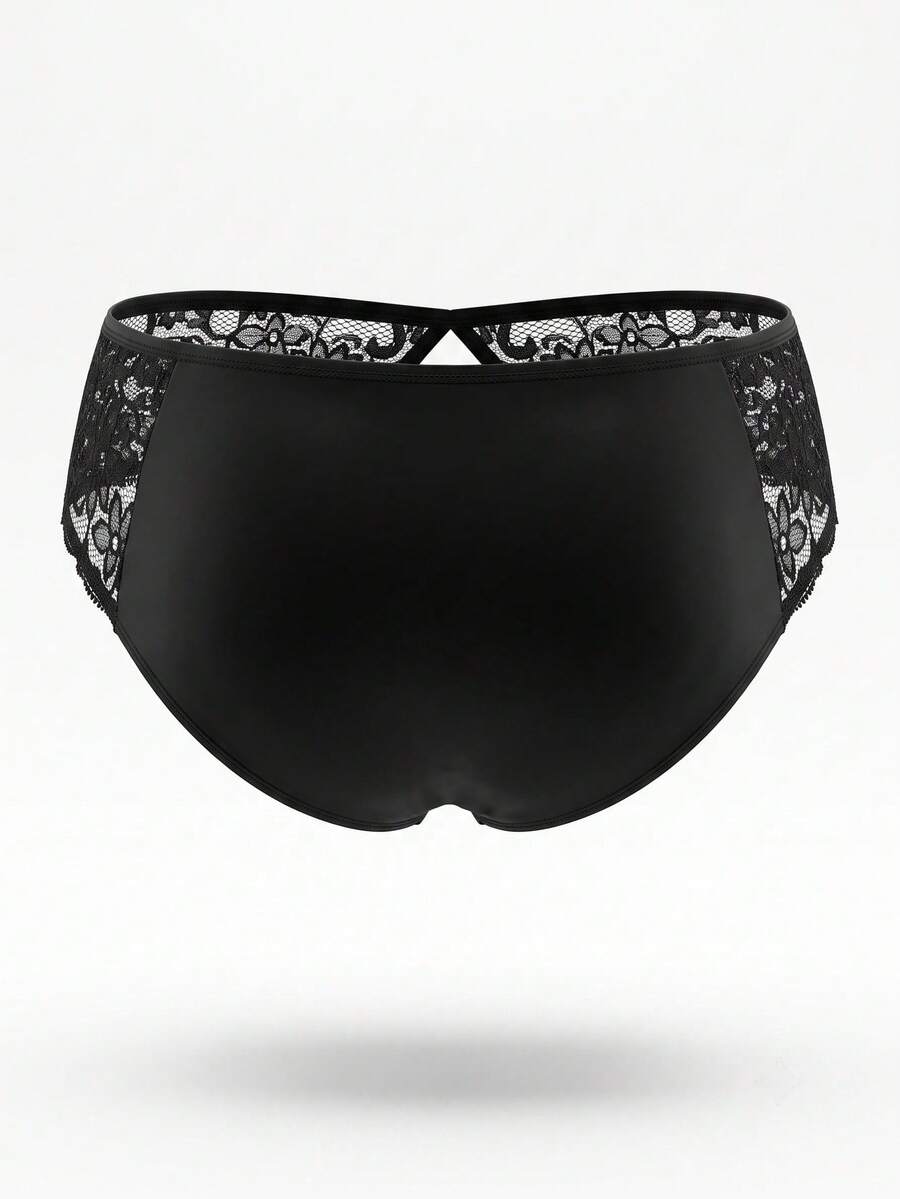Black low-rise men's brief featuring contrast lace patchwork and cut-out details.